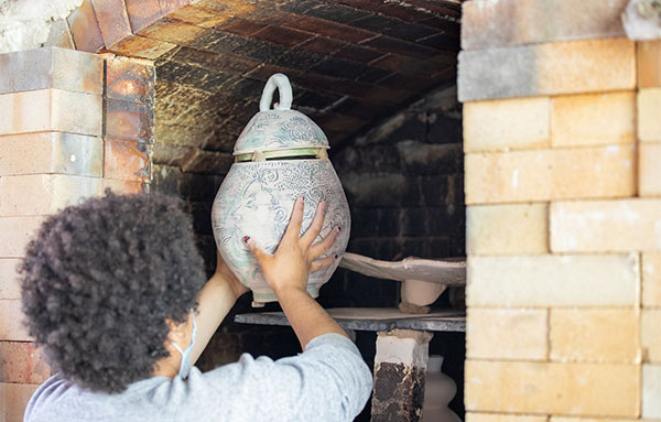 Ceramics student with vase