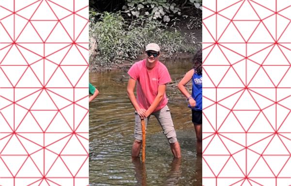 Summer Place SPLIT Director, Benjamin Dobbs, standing in a river.