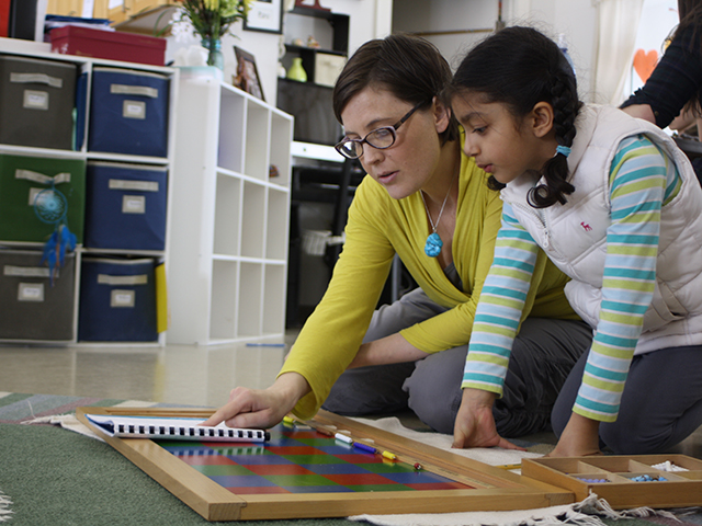 Montessori primary student and teacher